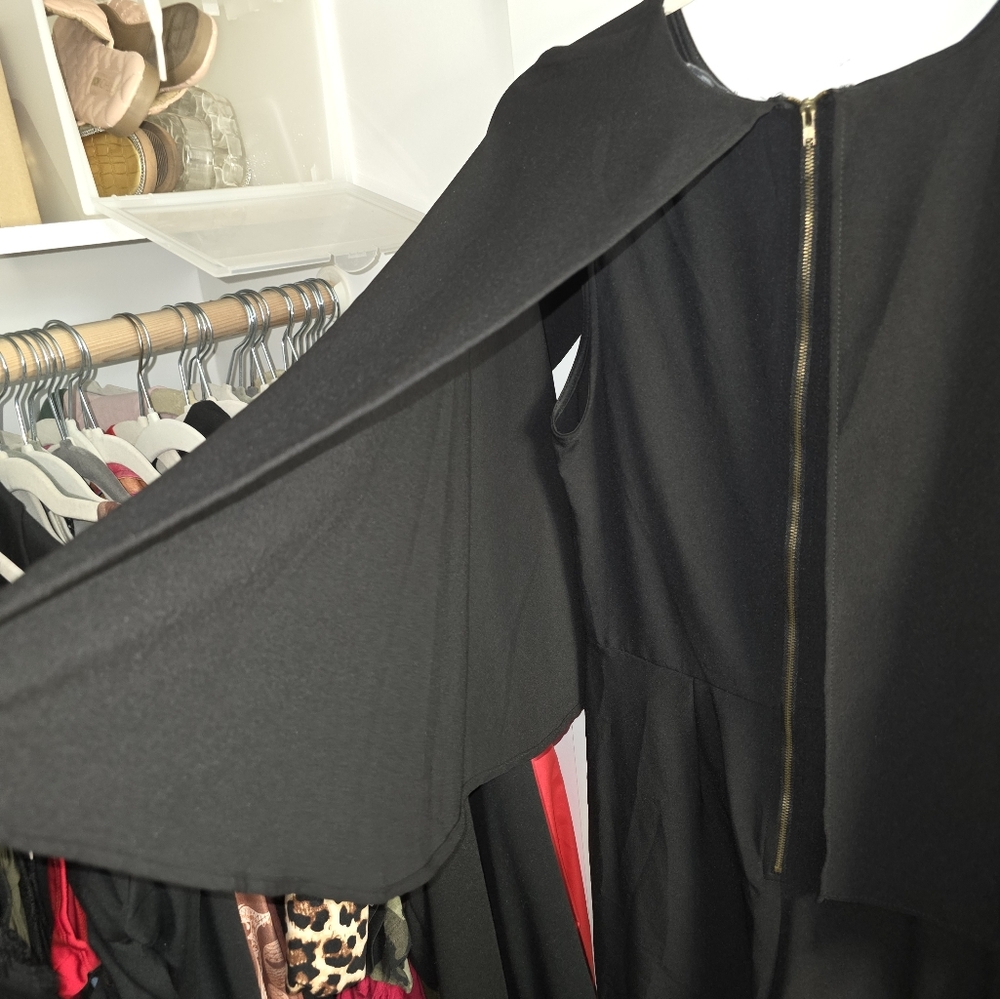 Black jumpsuit with mini cape